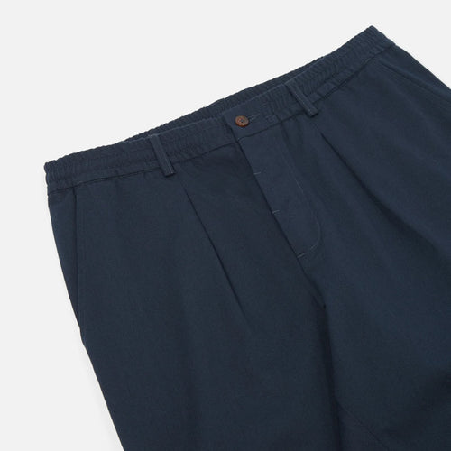UNIVERSAL WORKS Pleated Track Pant in Navy