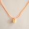 GUILA PARIS Cord Shell Necklace in Nude