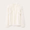 White blouse on a light gray background