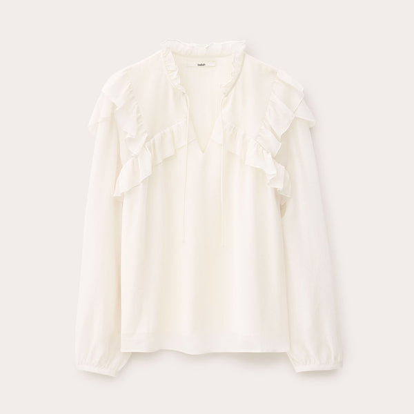 White blouse on a light gray background