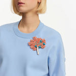 Fiore Buttoned Sleeve Sweatshirt in Light Blue