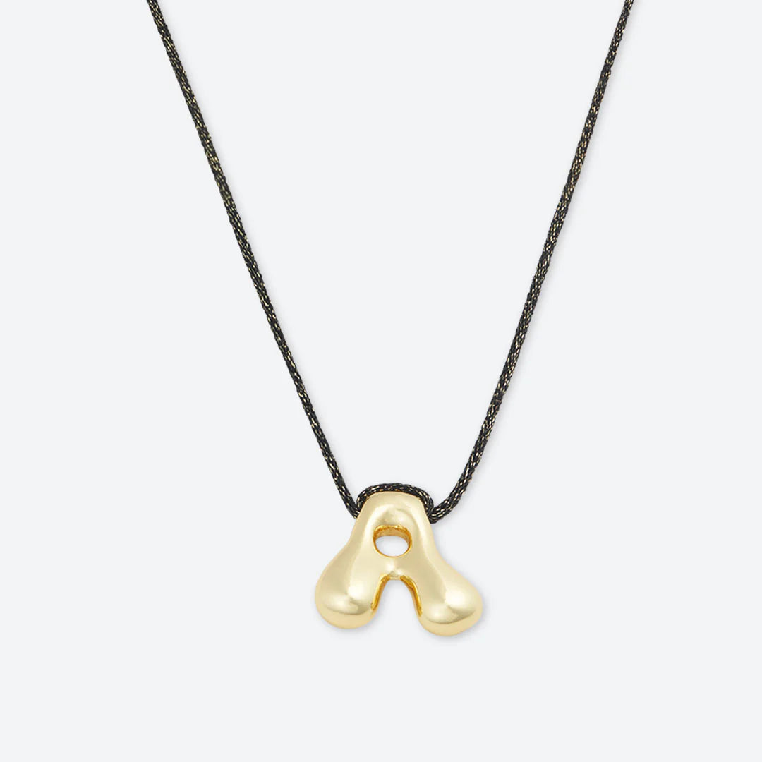 LA MOME BIJOU Joy Letter Necklace in Black/Gold