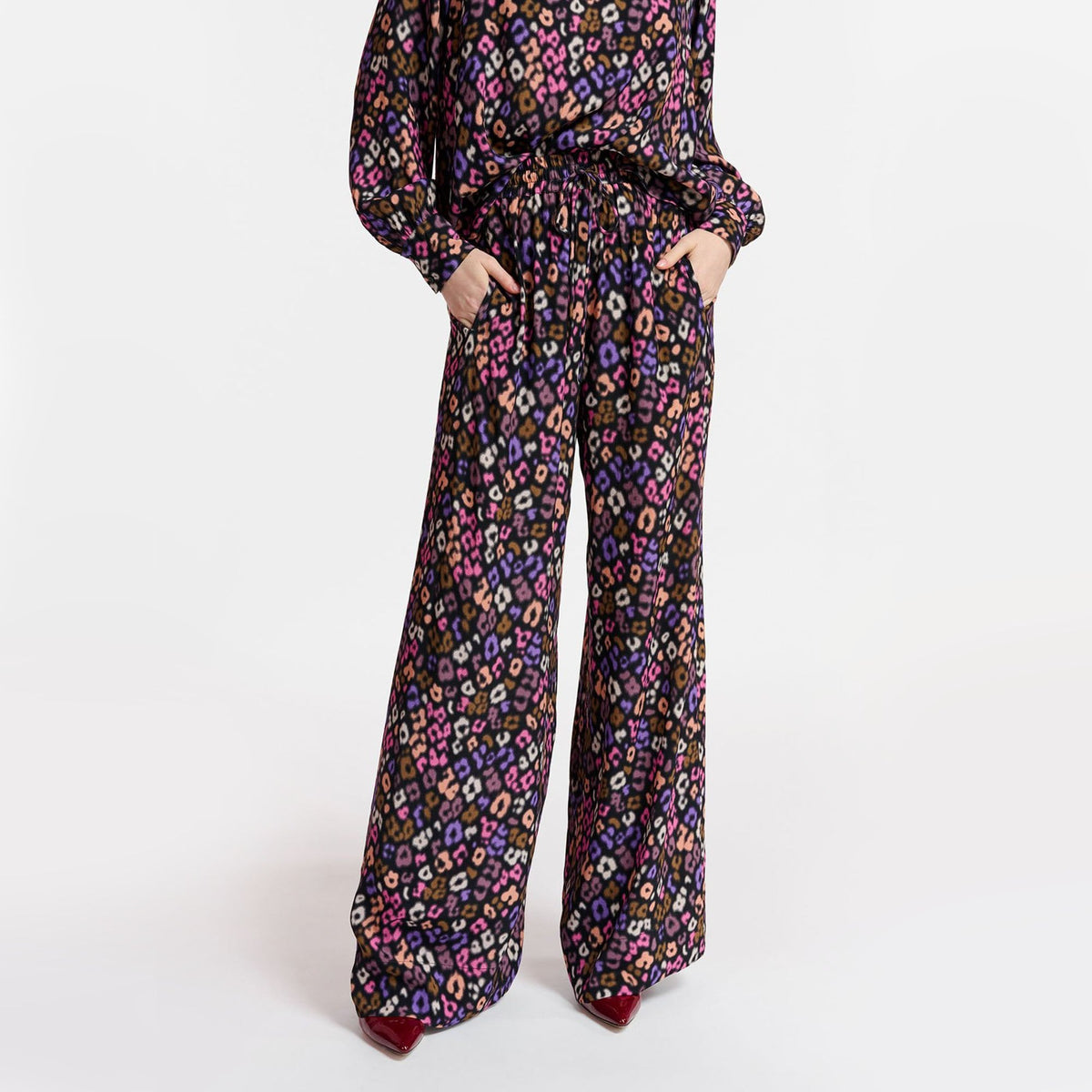 ESSENTIEL ANTWERP Extrovert Leopard Print Trousers in Black/Pink/Brown